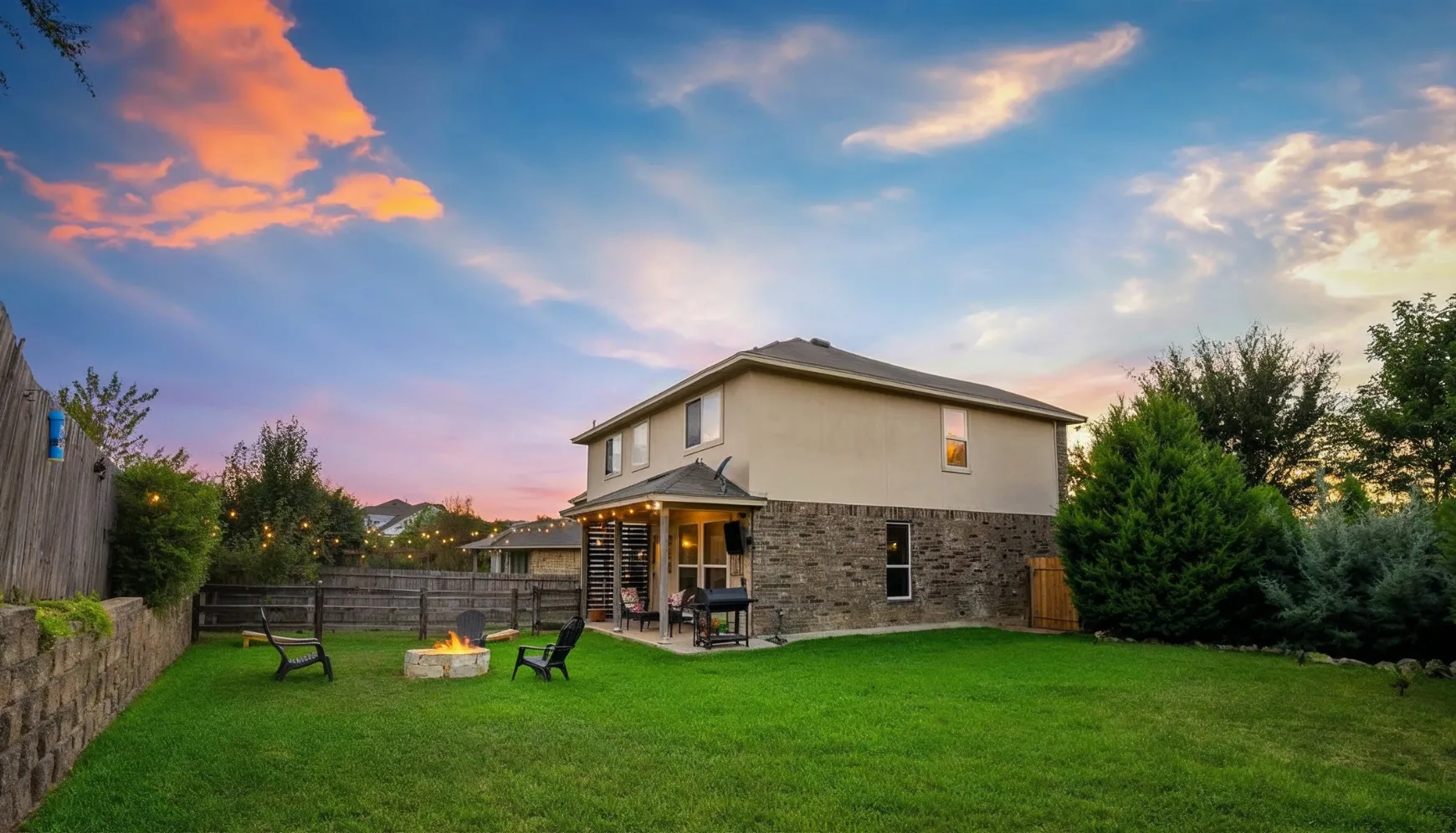 Backyard before attached ADU construction with open lawn and no extension